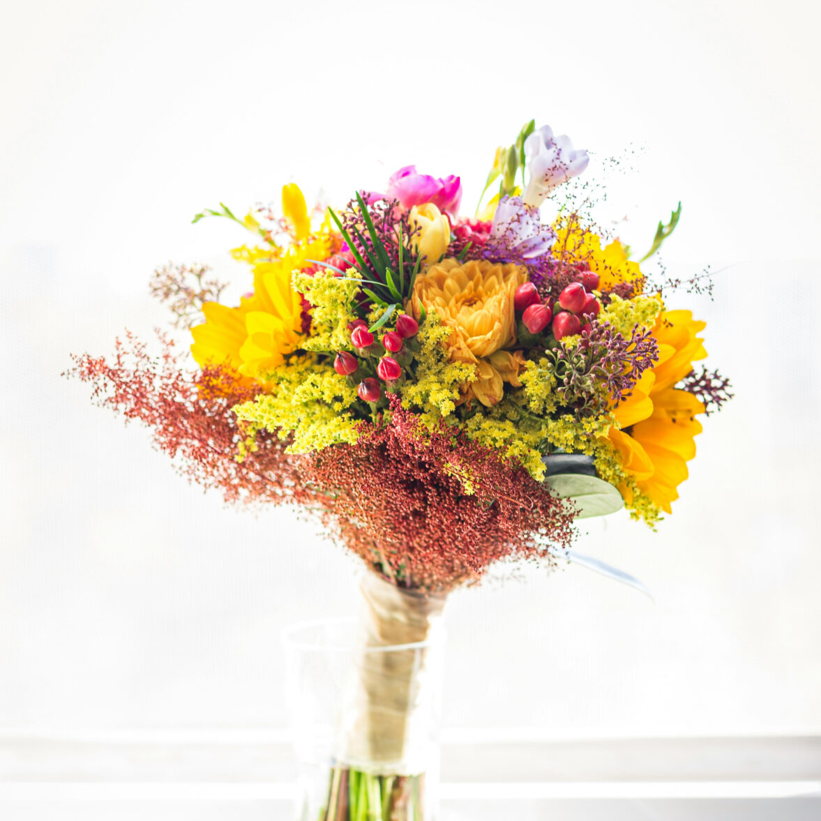 colorful-wedding-bouquet-at-the-window-with-mostly-yellow-flowers